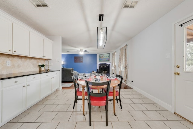 dining room with visible vents, ceiling fan, and baseboards