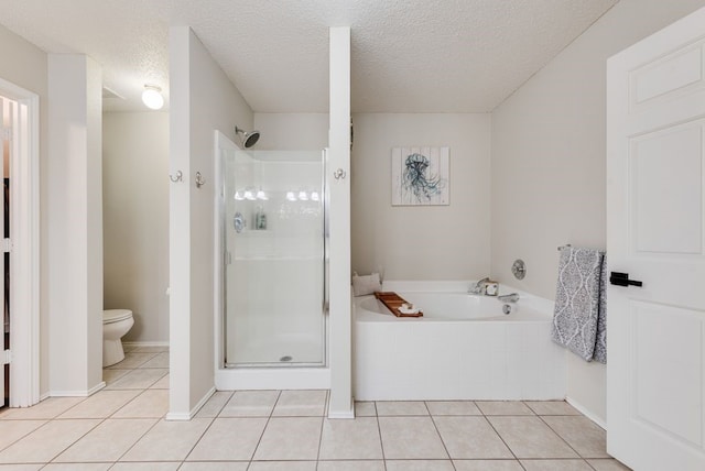 full bath with toilet, a garden tub, a shower stall, and tile patterned flooring