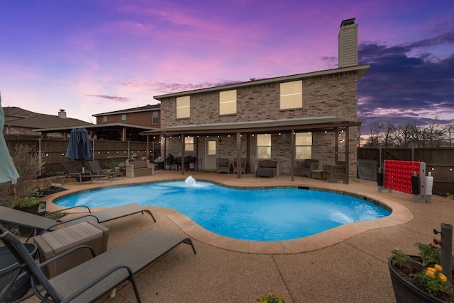 view of swimming pool with a fenced in pool, a patio area, and a fenced backyard