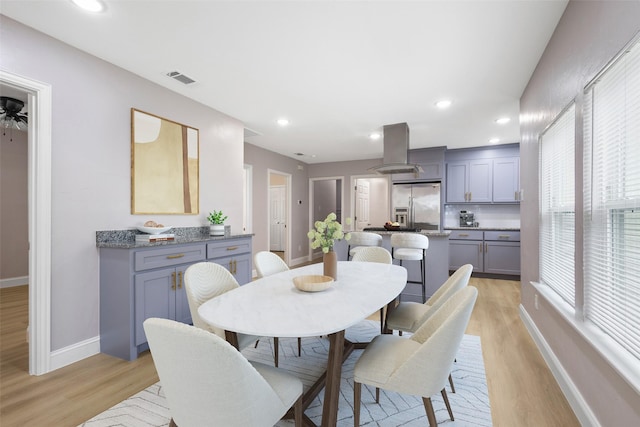 dining space featuring light wood-style floors, visible vents, baseboards, and recessed lighting