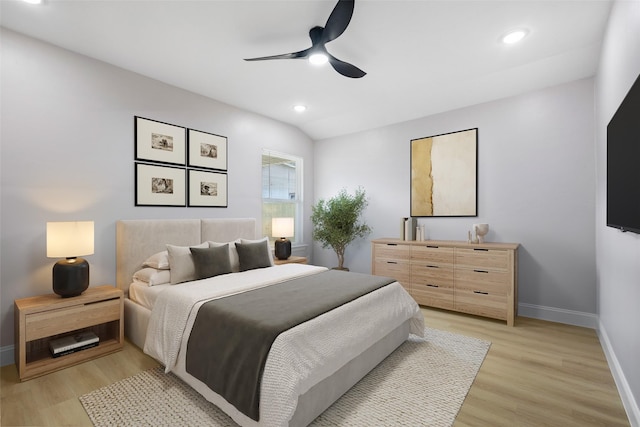 bedroom with recessed lighting, baseboards, lofted ceiling, and light wood finished floors