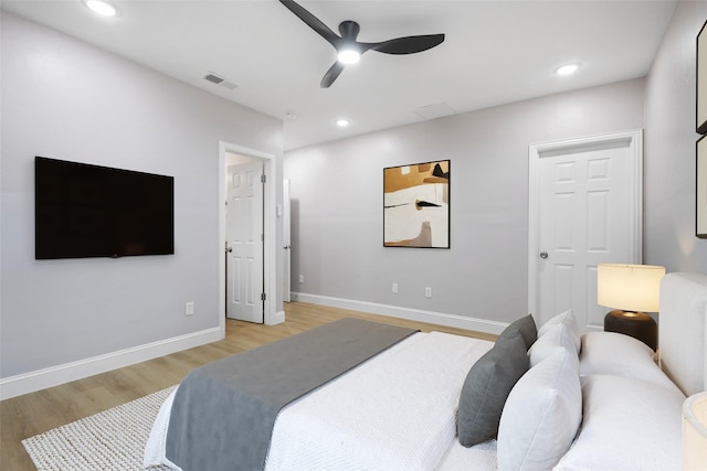 bedroom featuring baseboards, recessed lighting, visible vents, and light wood-style floors