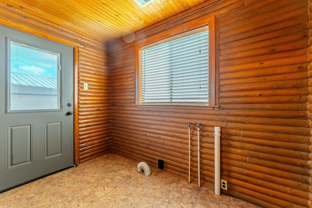 doorway featuring rustic walls and wood ceiling