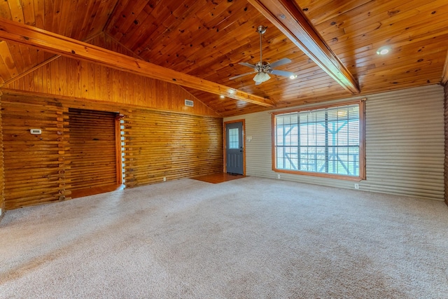 carpeted spare room with a ceiling fan, wooden ceiling, and lofted ceiling with beams