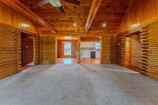 unfurnished living room featuring vaulted ceiling with beams, a ceiling fan, wood ceiling, and light colored carpet