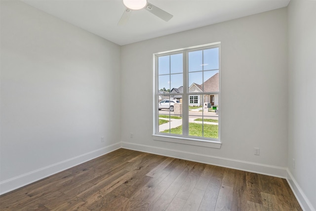 4618 Flat Creek Cv, Tyler, TX 75703 - spare room featuring baseboards, ceiling fan, and dark wood-style flooring