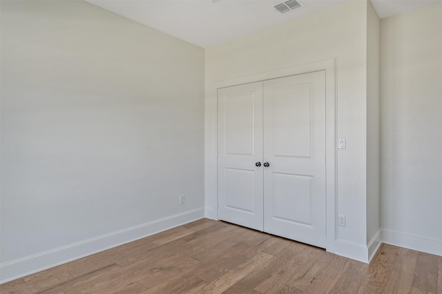 4618 Flat Creek Cv, Tyler, TX 75703 - unfurnished bedroom featuring light wood-type flooring, baseboards, and a closet
