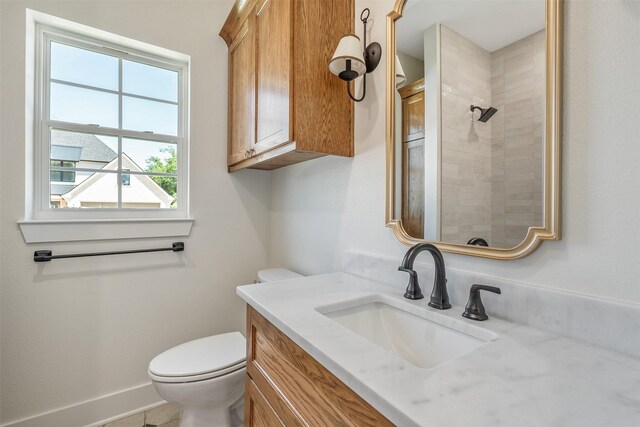 4618 Flat Creek Cv, Tyler, TX 75703 - bathroom with tiled shower, toilet, and vanity