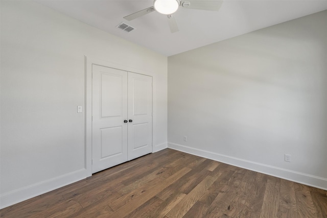 4618 Flat Creek Cv, Tyler, TX 75703 - unfurnished bedroom featuring baseboards, dark wood-style floors, a closet, and ceiling fan