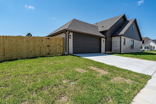 4618 Flat Creek Cv, Tyler, TX 75703 - view of front of home featuring driveway, an attached garage, brick siding, and roof with shingles