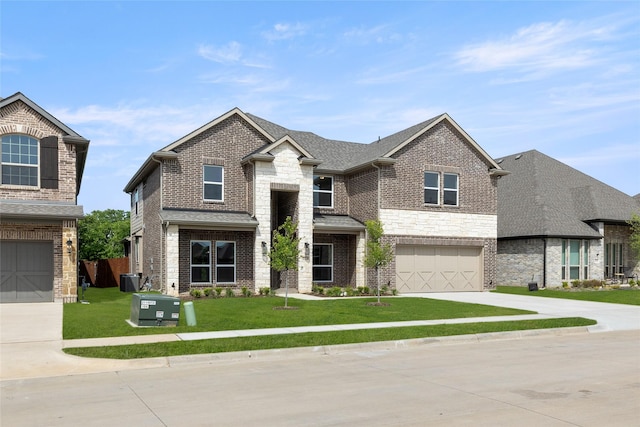 view of front of house with concrete driveway, roof with shingles, an attached garage, a front lawn, and brick siding