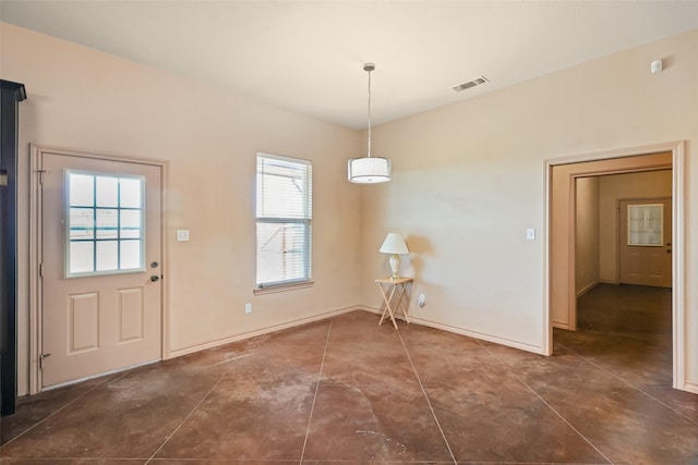 unfurnished dining area with visible vents and baseboards