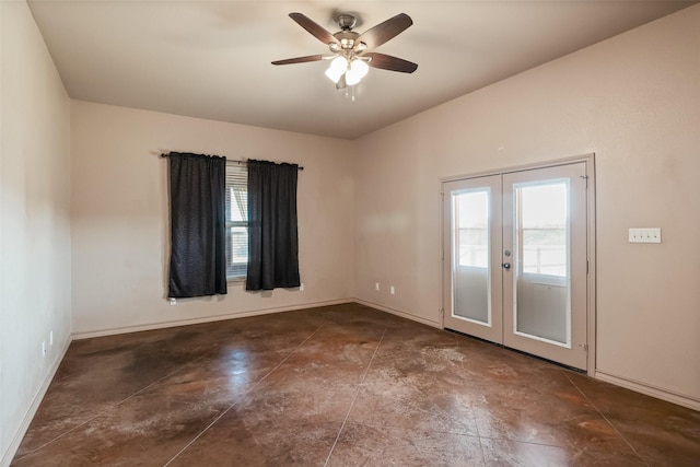 unfurnished room featuring baseboards, a ceiling fan, french doors, and concrete flooring