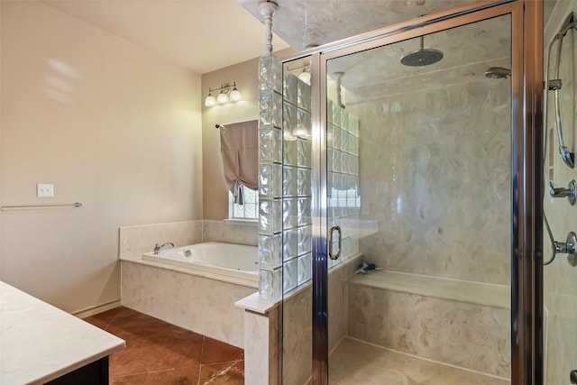full bathroom featuring tile patterned flooring, a stall shower, a bath, and vanity