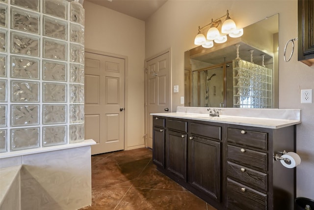 bathroom featuring tile patterned flooring, vanity, and a shower with door