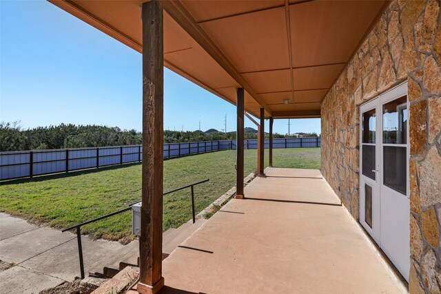 view of patio featuring fence