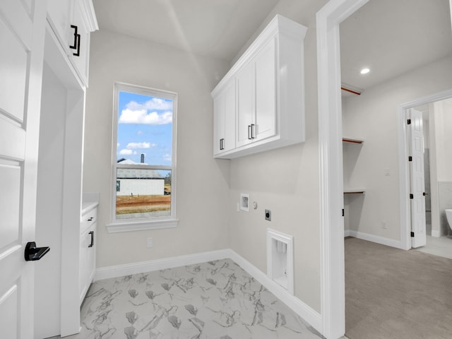 clothes washing area featuring cabinet space, baseboards, hookup for a washing machine, marble finish floor, and hookup for an electric dryer