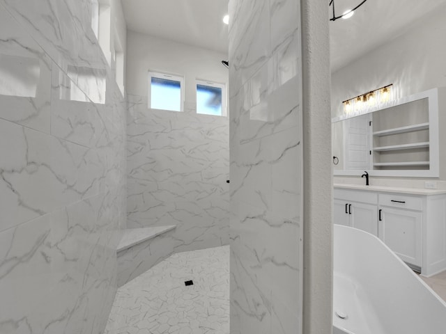 bathroom featuring a marble finish shower and vanity