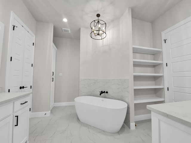 bathroom with visible vents, a soaking tub, marble finish floor, a closet, and recessed lighting