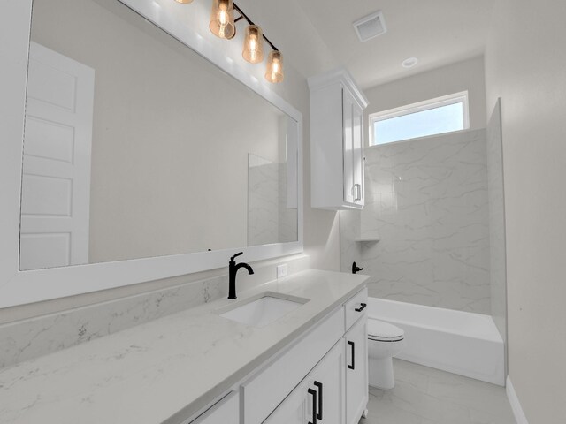 bathroom featuring marble finish floor, visible vents, toilet, washtub / shower combination, and vanity