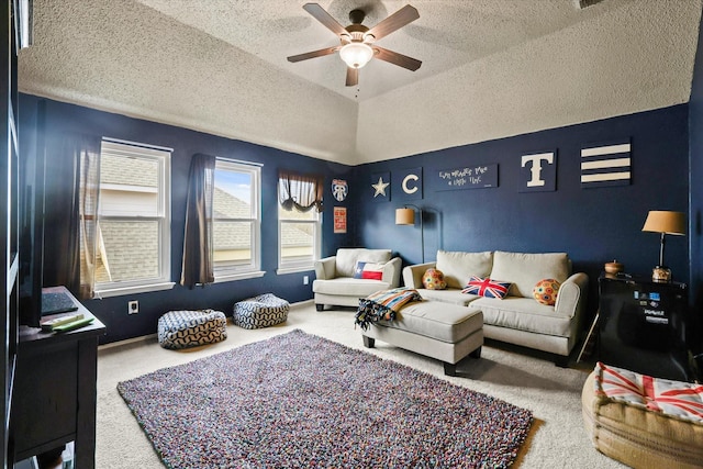 living area with lofted ceiling, a textured ceiling, carpet flooring, and a ceiling fan