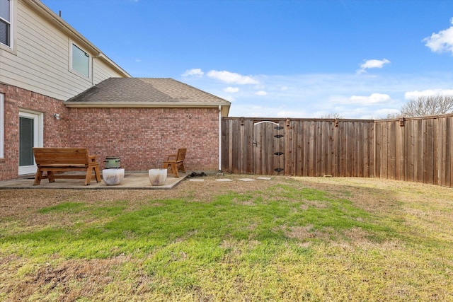 view of yard with a patio area and a fenced backyard