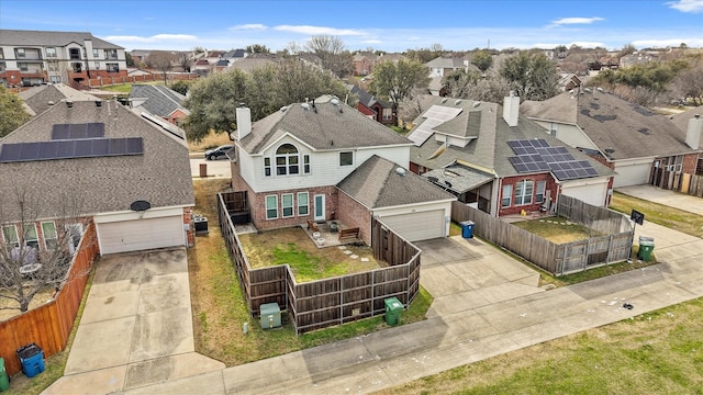 birds eye view of property with a residential view