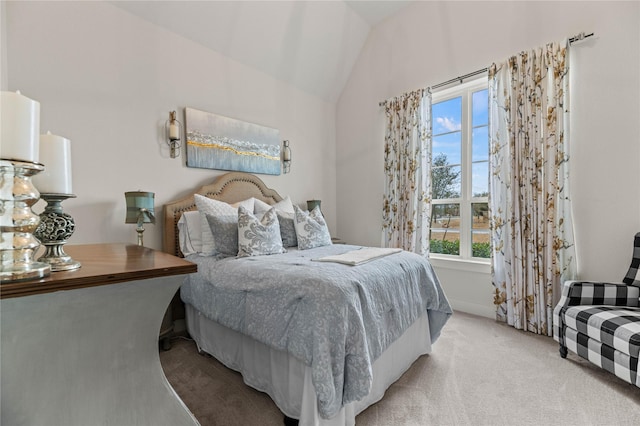 bedroom featuring carpet flooring and vaulted ceiling