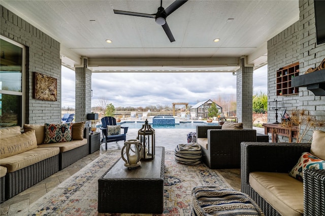 view of patio with an outdoor living space, ceiling fan, and a pool with connected hot tub