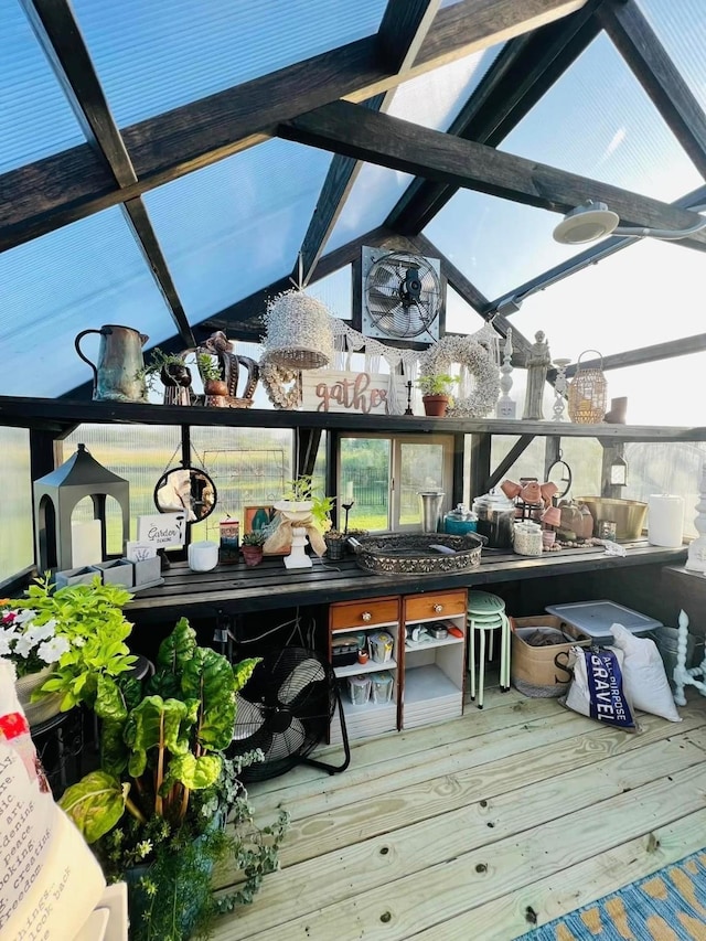 sunroom with lofted ceiling with beams