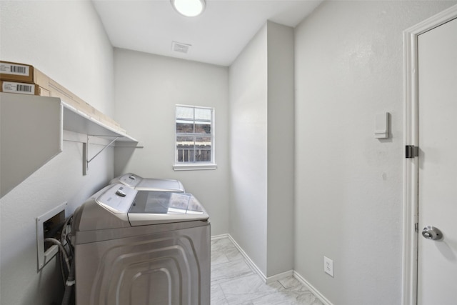 1153 Regal Dr, Garland, TX 75040 - laundry room with washing machine and dryer, light marble finish flooring, an office area, and baseboards