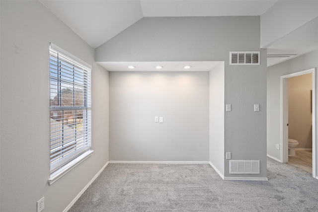 1153 Regal Dr, Garland, TX 75040 - carpeted spare room with lofted ceiling and baseboards
