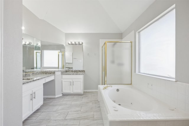 1153 Regal Dr, Garland, TX 75040 - full bath with a stall shower, a jetted tub, vanity, marble look tile flooring, and vaulted ceiling