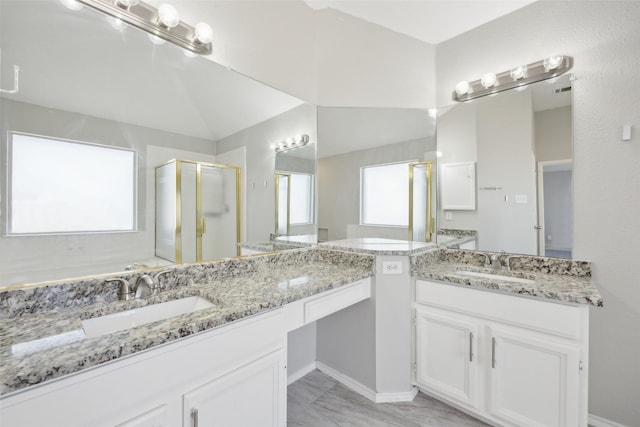 1153 Regal Dr, Garland, TX 75040 - full bathroom with a shower stall, two vanities, and marble look tile flooring