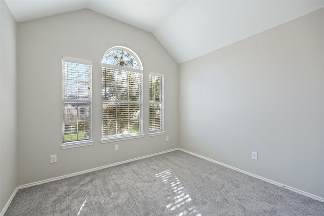 1153 Regal Dr, Garland, TX 75040 - carpeted empty room with lofted ceiling and baseboards