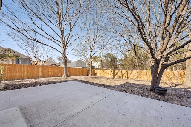 1153 Regal Dr, Garland, TX 75040 - fenced backyard featuring a patio area