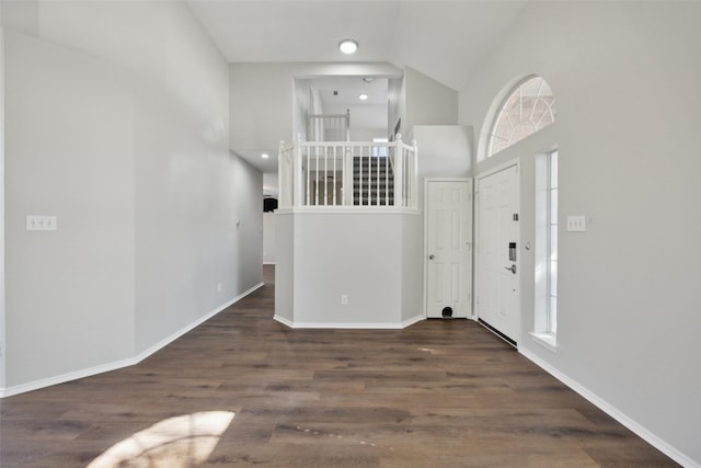 1153 Regal Dr, Garland, TX 75040 - entryway featuring high vaulted ceiling, baseboards, and wood finished floors