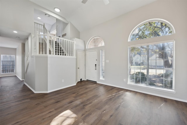 1153 Regal Dr, Garland, TX 75040 - foyer entrance featuring healthy amount of natural light, a towering ceiling, wood finished floors, baseboards, and recessed lighting