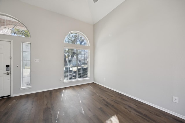 1153 Regal Dr, Garland, TX 75040 - entryway featuring wood finished floors, high vaulted ceiling, baseboards, and a ceiling fan