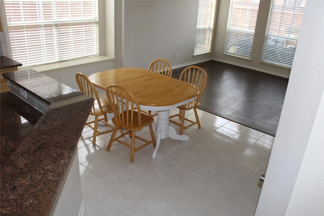 8509 Mustang Dr, Irving, TX 75063 - dining area with light tile patterned floors and baseboards