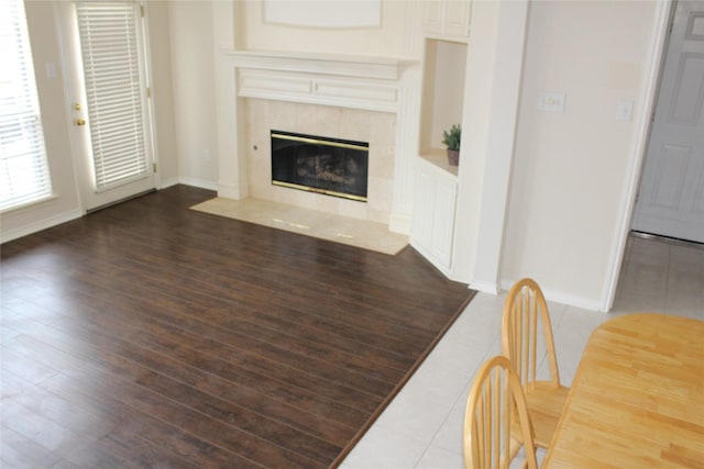 8509 Mustang Dr, Irving, TX 75063 - living area featuring a fireplace, baseboards, and wood finished floors