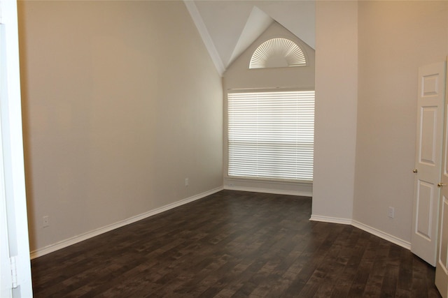 8509 Mustang Dr, Irving, TX 75063 - empty room with dark wood-type flooring, baseboards, and lofted ceiling