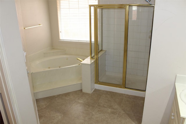 8509 Mustang Dr, Irving, TX 75063 - bathroom with tile patterned flooring, vanity, a tub with jets, and a stall shower