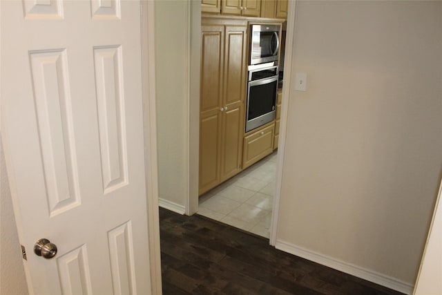 8509 Mustang Dr, Irving, TX 75063 - corridor with baseboards and dark wood finished floors