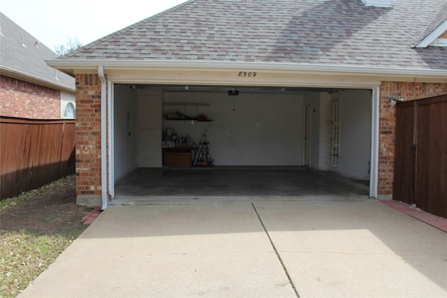 8509 Mustang Dr, Irving, TX 75063 - garage with concrete driveway and fence
