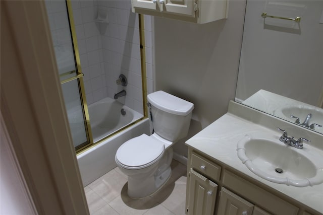 8509 Mustang Dr, Irving, TX 75063 - bathroom featuring vanity, toilet, bath / shower combo with glass door, and tile patterned flooring