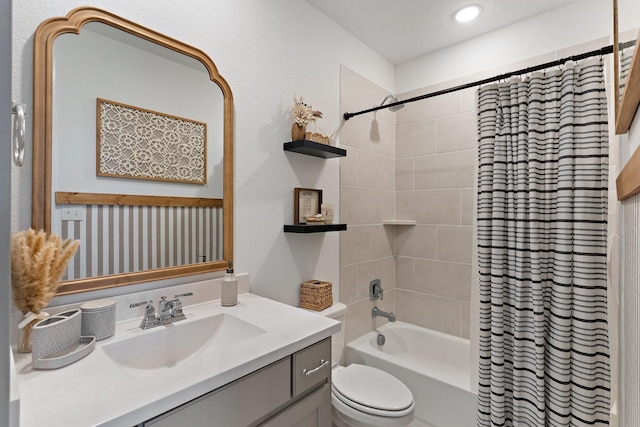 bathroom with vanity, toilet, and shower / tub combo with curtain