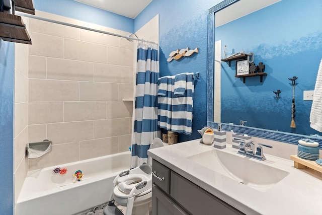 full bath with a textured wall, shower / tub combo with curtain, vanity, and toilet