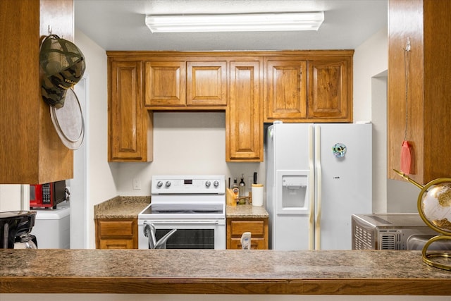 kitchen with white appliances and brown cabinets