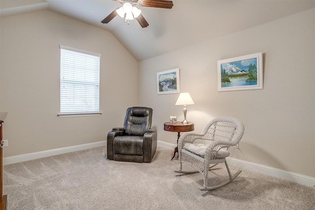 sitting room with lofted ceiling, carpet flooring, and baseboards